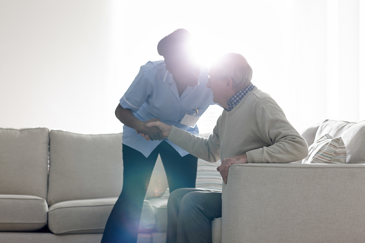 Female caregiver with elderly male client