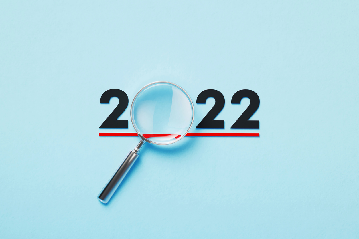 Graphic of 2022 with magnifying glass symbolising review - 2022: an unexpected first quarter
