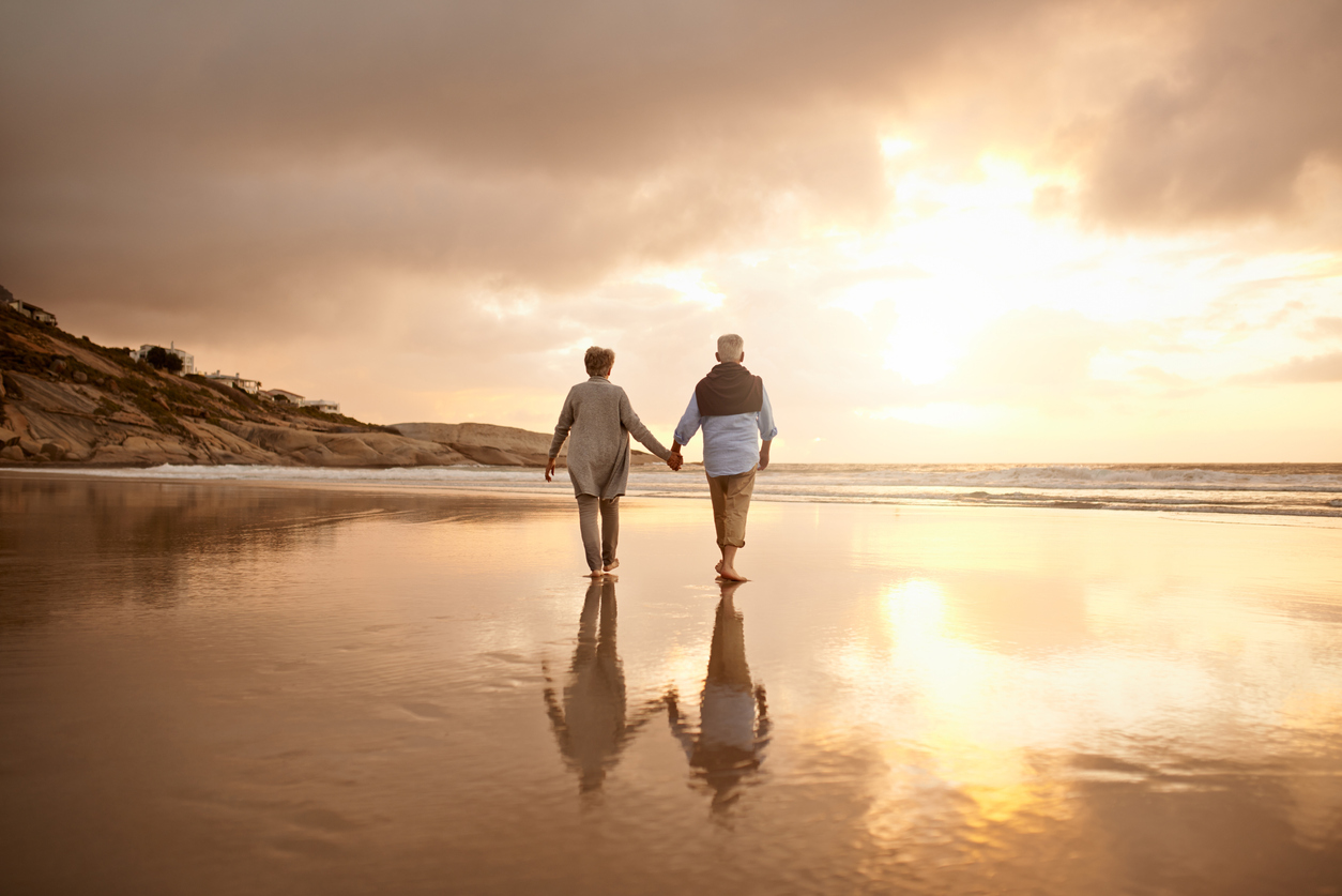 Mature man and woman walking off into the sunset - who gets to choose when you retire