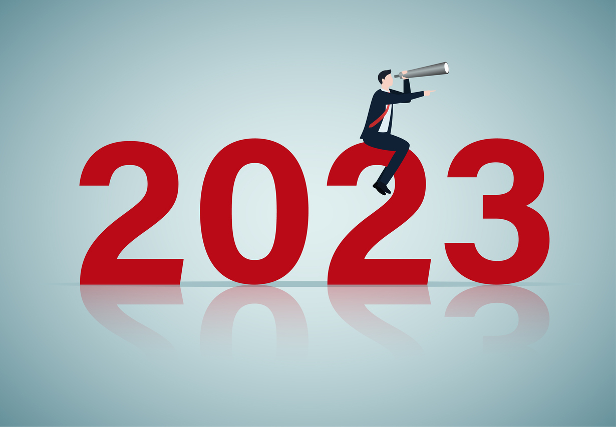 Graphic of 2023 with person sitting on it holding telescope representing looking ahead to the new year