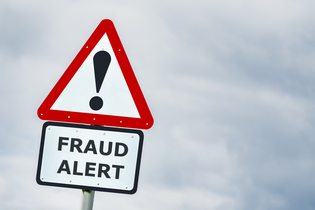 Road sign reading Fraud Alert representing financial scams - Regulator warns on financial scams