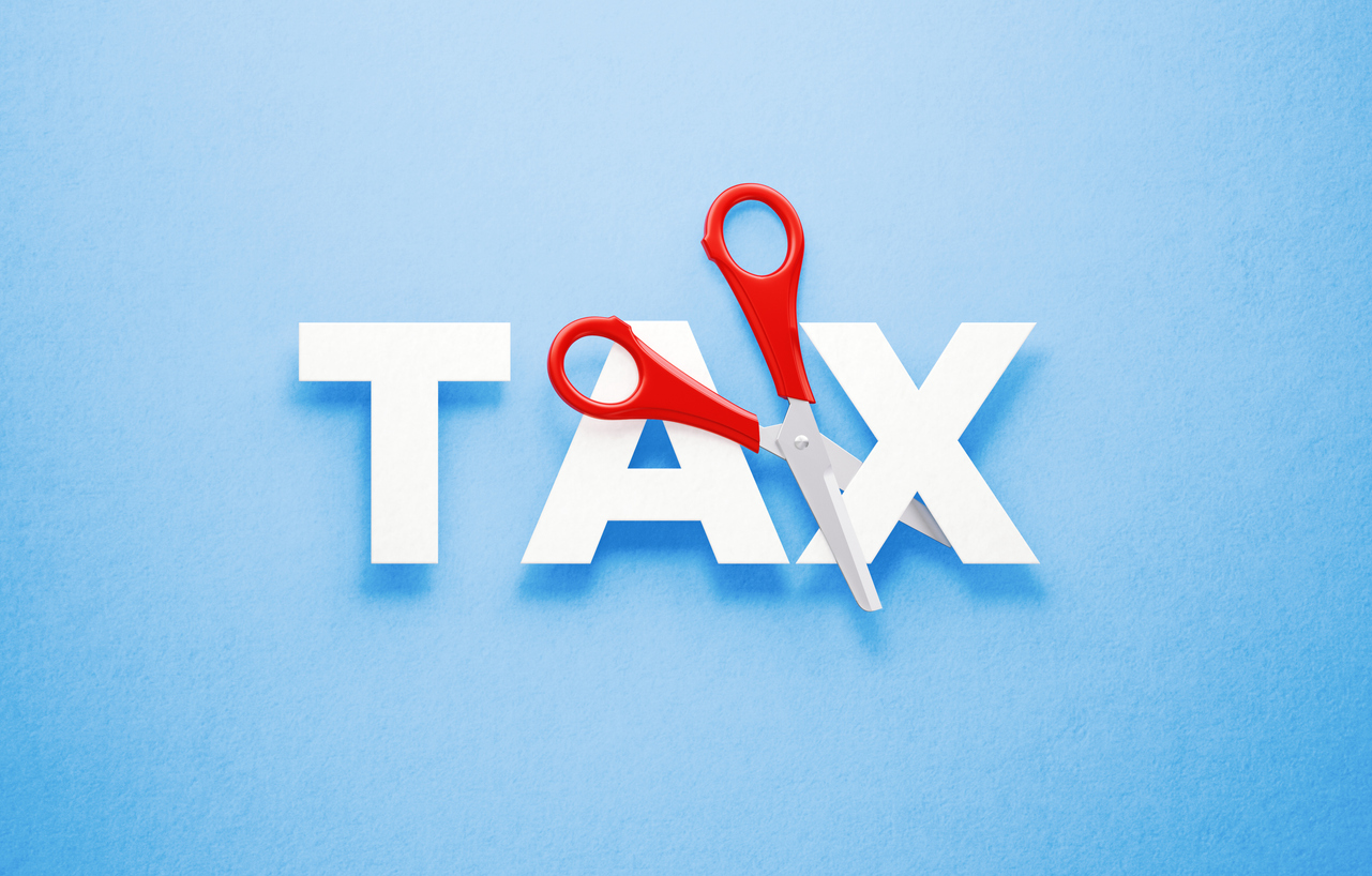 Graphic of the word Tax with a pair of scissors representing tax changes in the new Tax Year