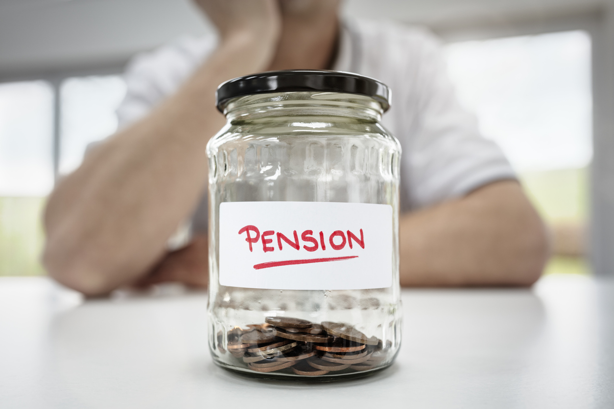 Jar full of coins with a label reading 'Pension' - state pension age increase deferred