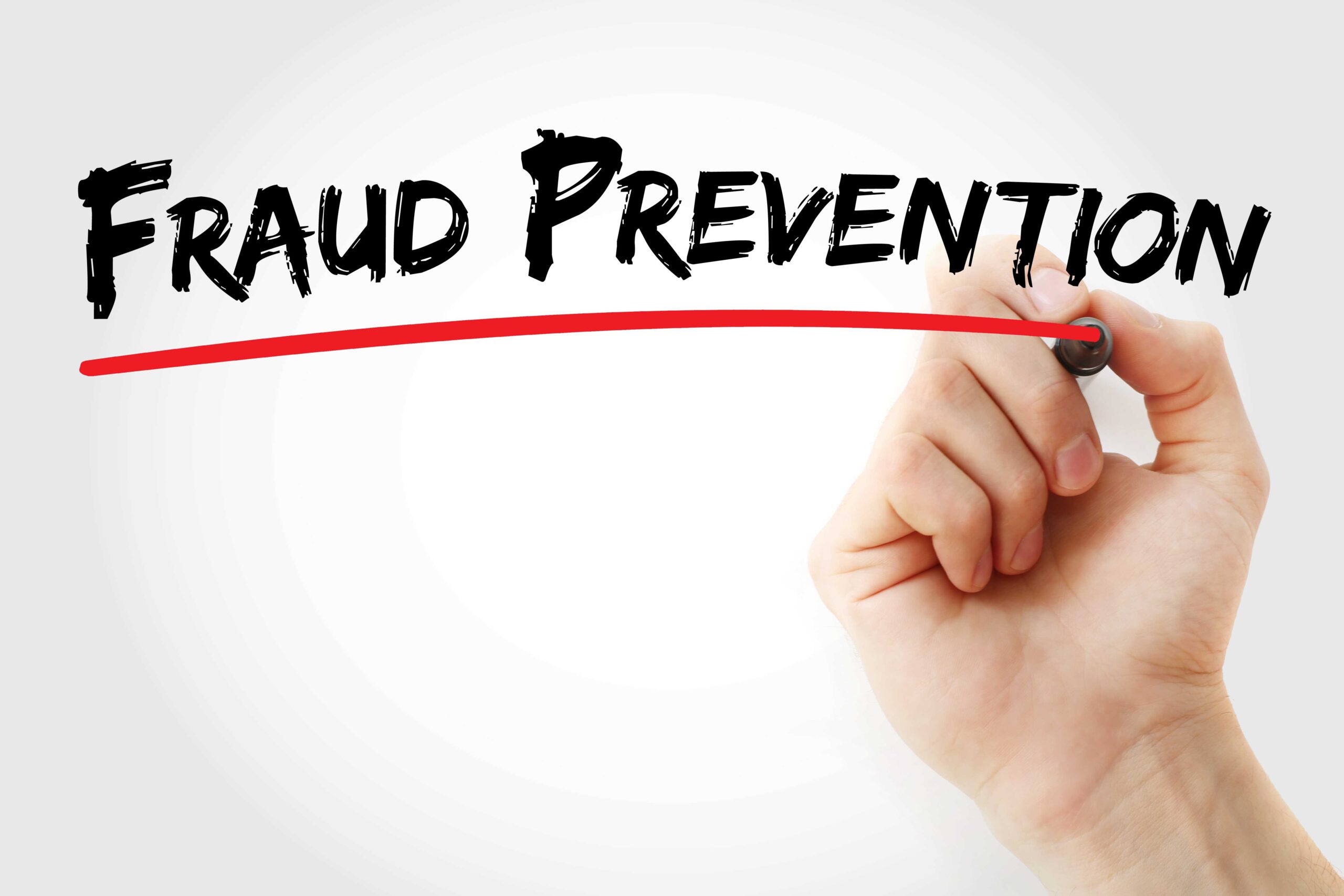 Graphic of a hand writing 'Fraud Prevention' and underlined in red ink - government initiative to counter fraud